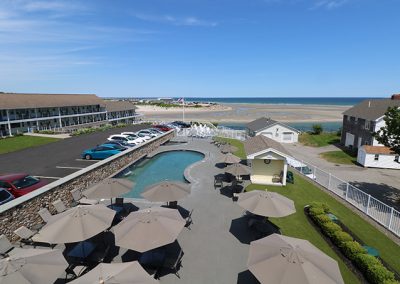 View of the pool and low-tide beach from balcony.